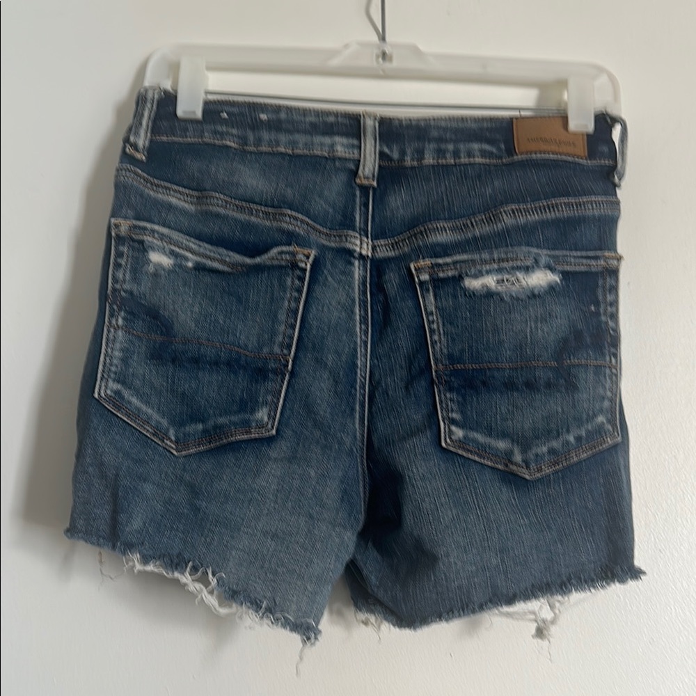 EUC American Eagle Next Level Stretch Blue Distressed Jean Shorts with Raw Hem - Picture 5 of 5